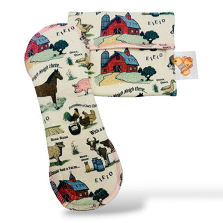 SoCo Studio reusable organic cotton menstrual pad with a whimsical farm animal print and secure snap wings.